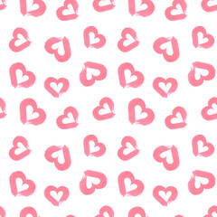 Seamless watercolor pattern of brush strokes in the shape of pink hearts isolated on a white background. The texture of the brush with pink paint