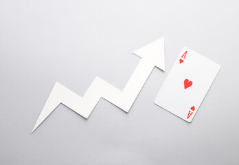 Growth arrow with ace of hearts on gray background