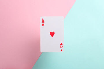 Ace of hearts on pink blue background. Playing card