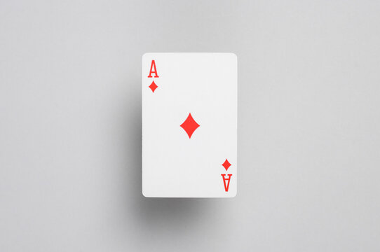 Ace of diamonds on a gray background. Playing card
