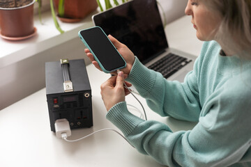 Charging station for phone, tablet, laptop and other gadgets when there is no light during...