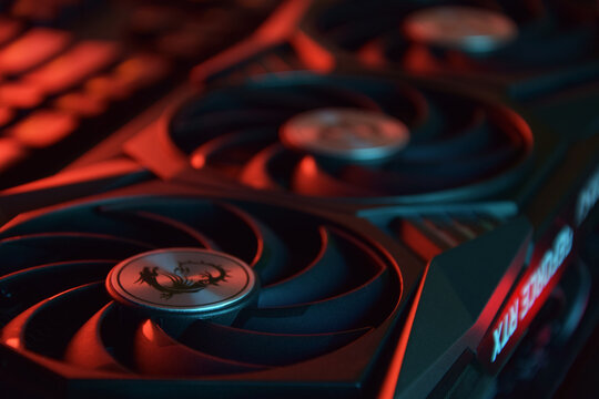 MSI Geforce RTX 3090 Ti gaming X TRIO graphics card, dark background.