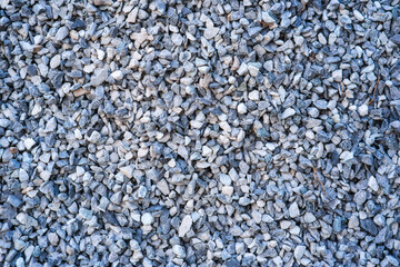 Black ground pile of stones for construction.