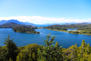 Fototapeta na wymiar Landscape of Lake Nahuel Huapi. Bariloche, Río Negro, Argentina. Patagonia. Panoramic view. Touristic city. Mountains and lake. pine forests. Islands.