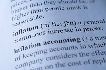 A mock up of a dictionary page with the word inflation with selective focussing
