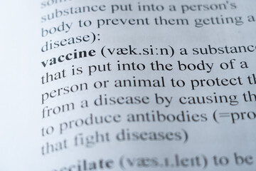 A mock up of a dictionary page with the word vaccine with selective focussing