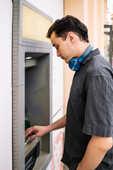 Fototapeta premium man withdraws money from ATM