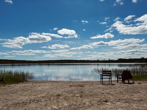 Two chairs in front of the lake, lake view, no people, very quiet and romantic