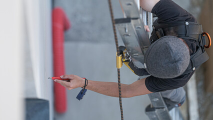 an electrical engineer of the team installs the electrical cables for the autonomous photovoltaic...
