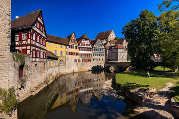 Fototapeta premium Idyllic panorama in a German old town on a river with city wall and half-timbered houses