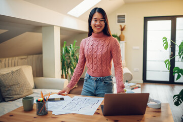 Vietnamese Asian woman posing in her home office