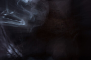Abstract white smoke on dark background