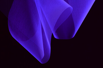 Futuristic abstract background. Translucent unusual shapes. Organza on a dark background. Purple fabric texture.
