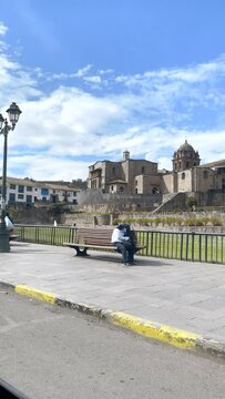 Establishing Street View Aerial Fly Drone View of Cusco, Peru with Coricancha  Temple of The Sun and bus stop. High resolution 4k footage. View of Cusco Peru with the historic downtown and Cathedral.
