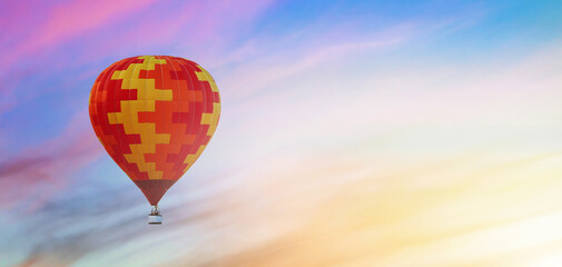 balloon in flight against the background of colorful sunset sky