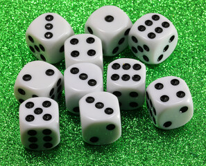 gambling dice on green shiny casino table