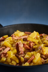 Potatoes and ham in a wok