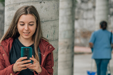 Fototapeta premium student at school looking at mobile phone