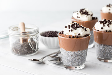 Servings of chocolate mousse chia pudding parfaits, ready for eating.