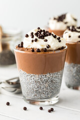 Close up of a chocolate mousse chia pudding parfait ready for eating.