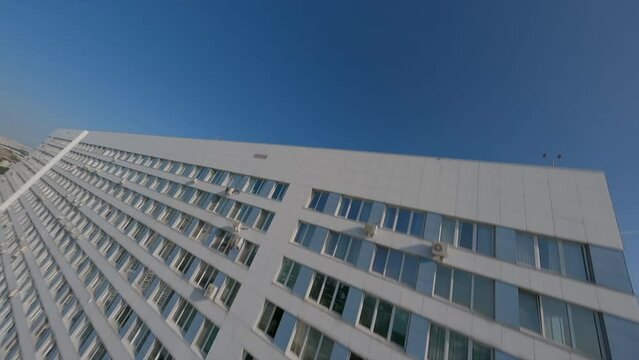 Dynamic fpv spans along and near multi-storey buildings, industrial cinematic