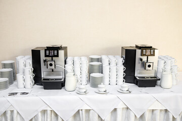 Coffee machines are ready for meeting guests at the event. Business conference in a hotel.