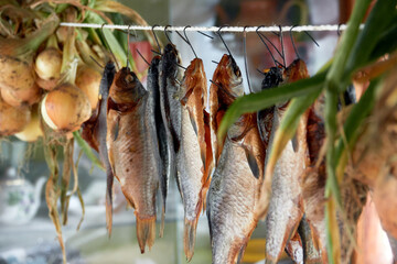 River fish dried on ropes.