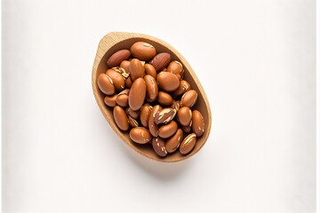  a wooden spoon filled with nuts on top of a white table top next to a white wall and a white background behind it is a wooden spoon with nuts in it and a wooden spoon.