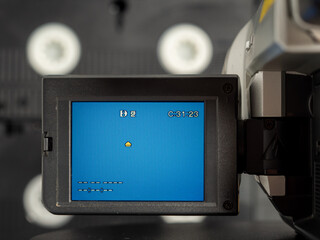 Vintage retro video camera, tape recorder, close-up object. Outdated old technology, film...
