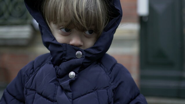 Baby Toddler Wearing Winter Clothes. Two Year Old Child Wears Jacket Covered