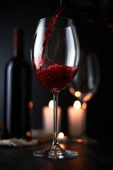 glass of red wine on a dark background. wineglass