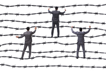 Businessman in barbed wire concept