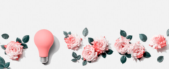Light bulb with pink roses - flat lay