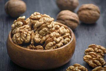 walnuts in bamboo wooden bowl