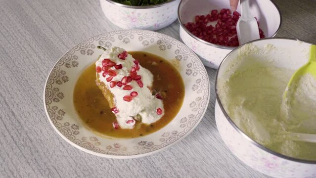 Chiles en nogada, traditional mexican dish from Puebla, Mexico. It consists of poblano chilis filled with picadillo topped with a walnut-based cream sauce, pomegranate and chopped parsley. 