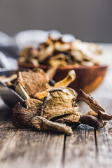 Sliced dried mushrooms on wooden table.