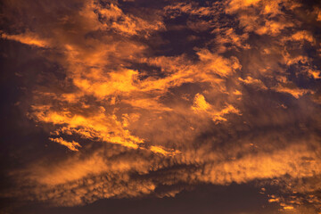 Texture of sunset with clouds on a red sky