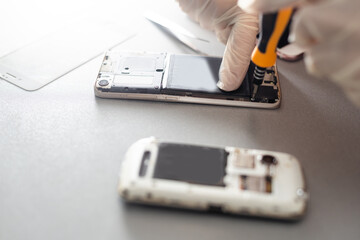 Technician prepairing to repair and replace new screen broken and cracked screen smartphone prepairing on desk.
