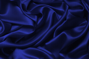 Rich and luxury red silk fabric texture background.