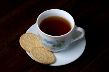 White cup with hot tea