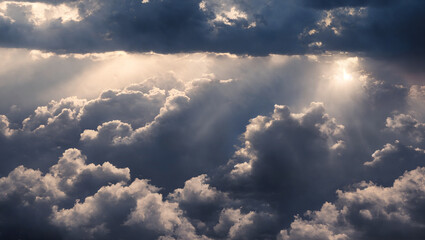 An aerial shot above beautiful cloudscape with sun rays coming through the clouds, detailed...