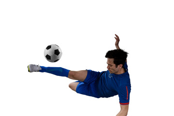 Close up of a football action scene with soccer  player kicks a soccerball