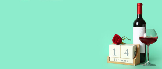 Bottle and glass of wine, rose flower and calendar on mint background with space for text. Valentine's Day celebration
