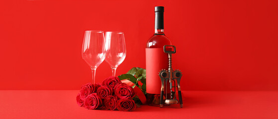 Bottle of wine, rose flowers, glasses and corkscrew on red background. Valentine's Day celebration