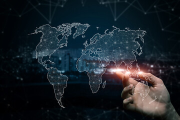 Hand clicks on a world map in a network of connections .