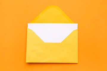 Yellow envelope with card on color background