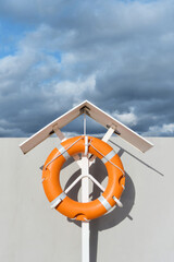 Close-up of a lifebuoy on the pier. Rescue concept