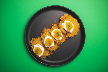 Potato meal with cream cheese and pike caviar. Food photography. Restaurant serving food. Delicacy.