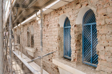 Fototapeta na wymiar wooden windows in historical building under construction in the port of malaga