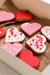 Box with tasty heart shaped cookies, closeup. Valentine's Day celebration